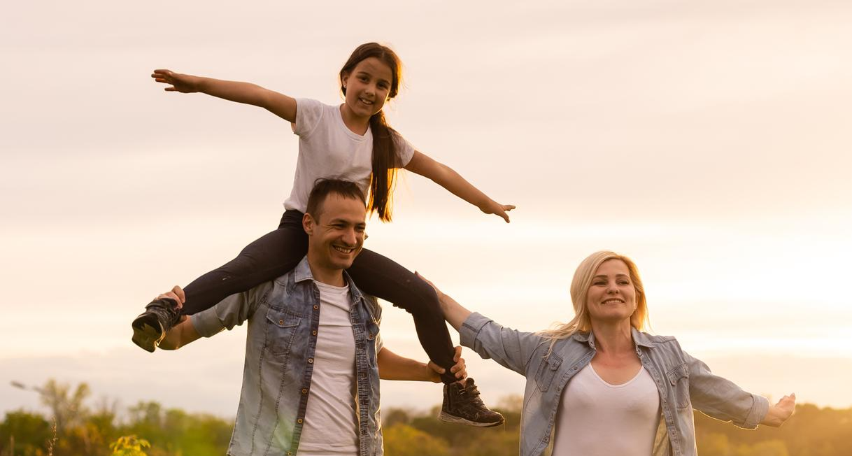 Parent and child walking together outdoors